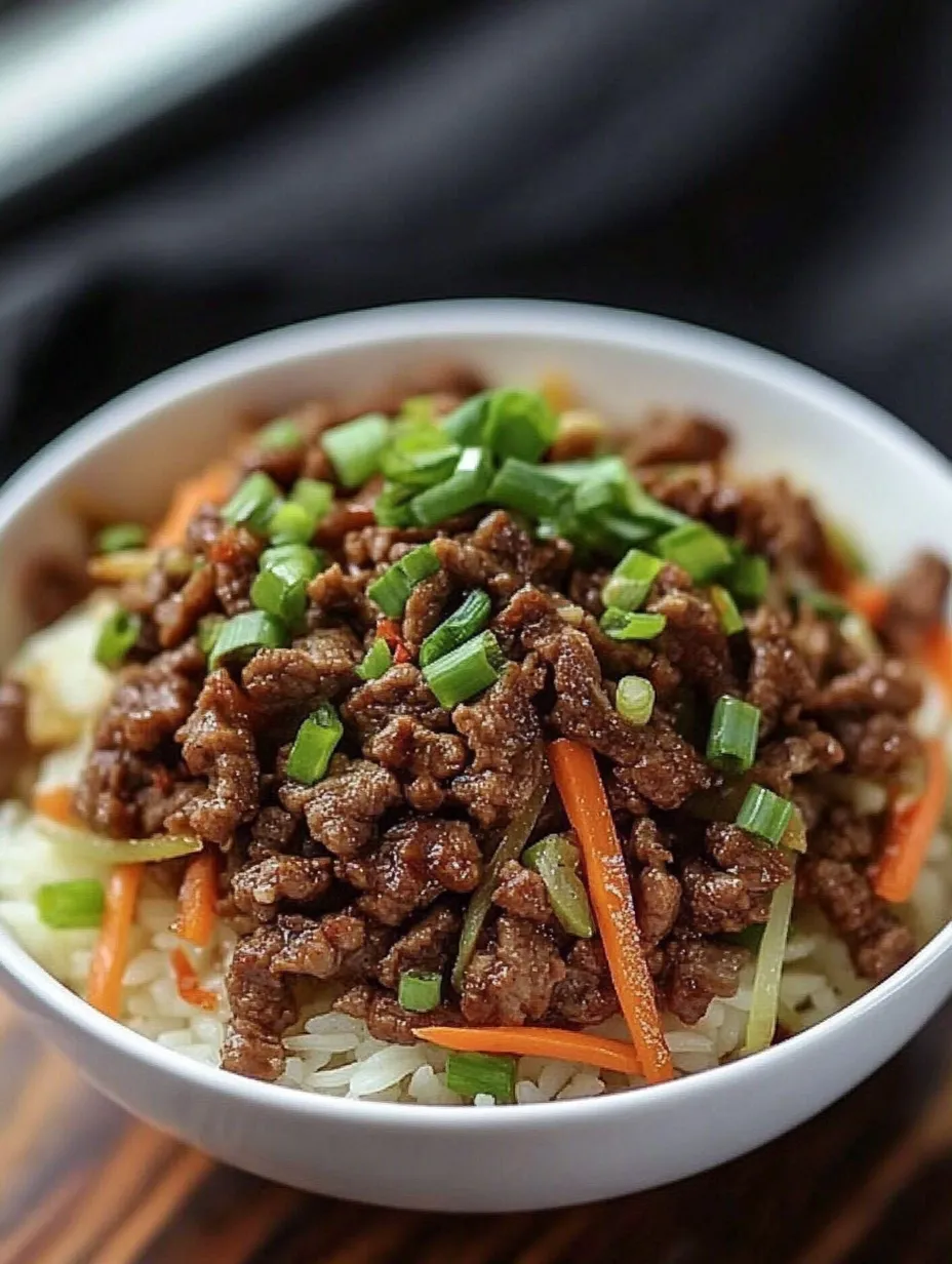A bowl of Asian garlic beef over rice.